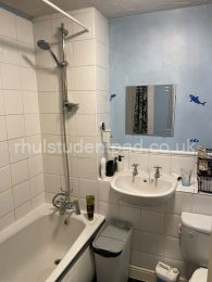 top floor bathroom with over shower & toilet